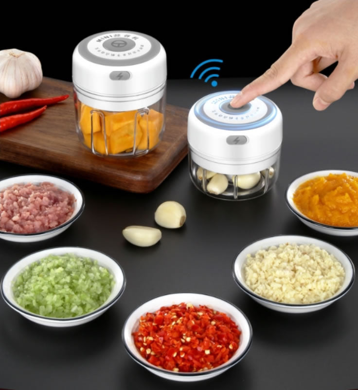 Two white Quick Chop electric food choppers with bowls of chopped ingredients